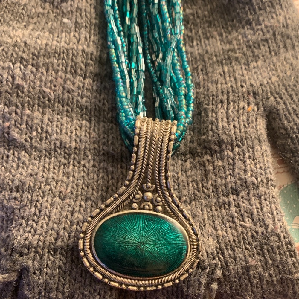 Turquoise Beaded Necklace with Intricate like silver pendant